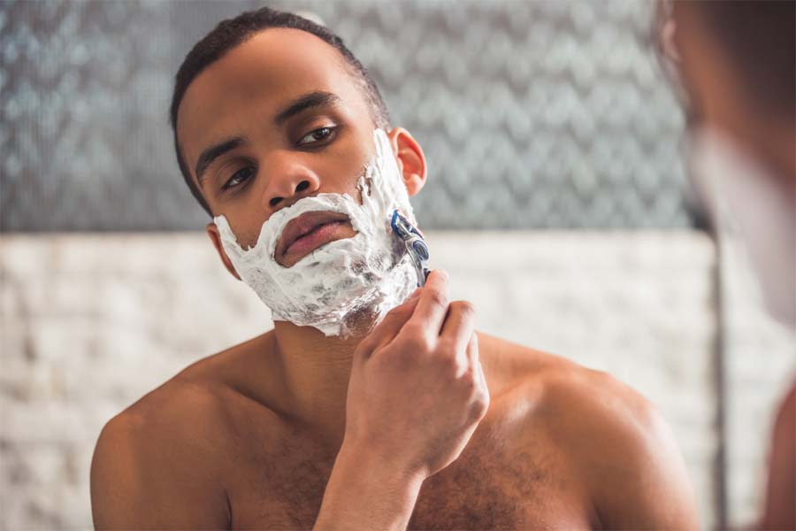 man shaving wet